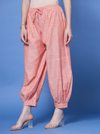 Peach self design cotton loose fit Afghani salwar with elasticated waistband and embellished hemline.