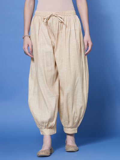 Beige self design cotton loose fit Afghani salwar with elasticated waistband and drawstring.