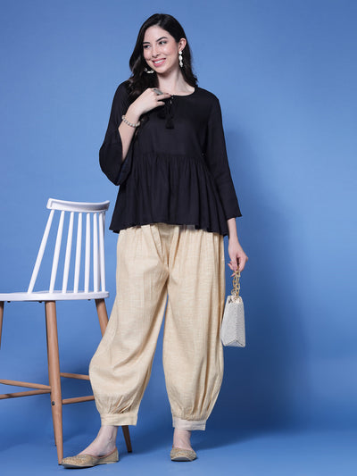 Beige self design cotton loose fit Afghani salwar with elasticated waistband and embellished hemline.