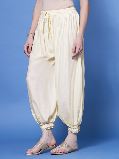 Cream embellished hem loose fit Afghani salwar with elastic waistband and drawstring.