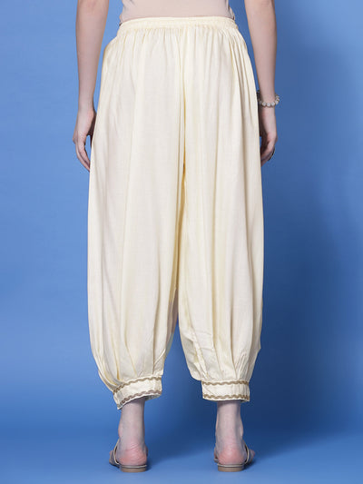 Cream embellished hem design loose fit Afghani salwar with elastic waistband.
