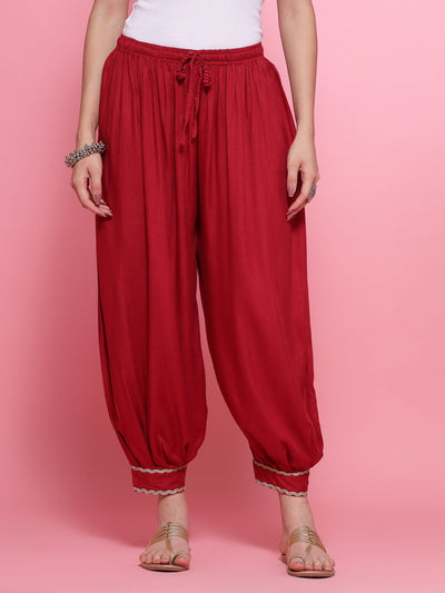 Maroon Afghani salwar with embellished hem and elasticated waistband.