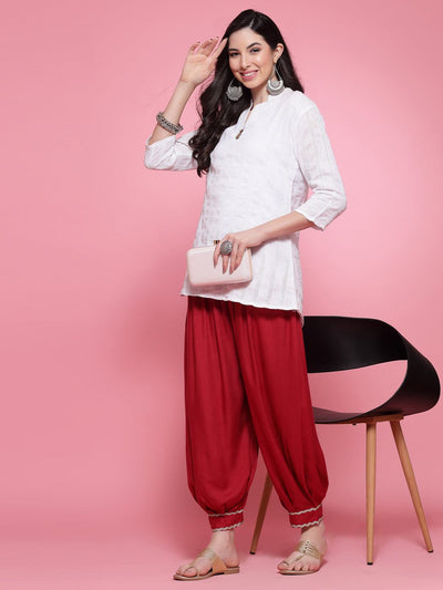 Maroon embellished hem loose fit Afghani salwar with elastic waistband.
