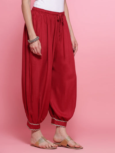 Maroon embellished hem design loose fit Afghani Salwar with elasticated waistband.