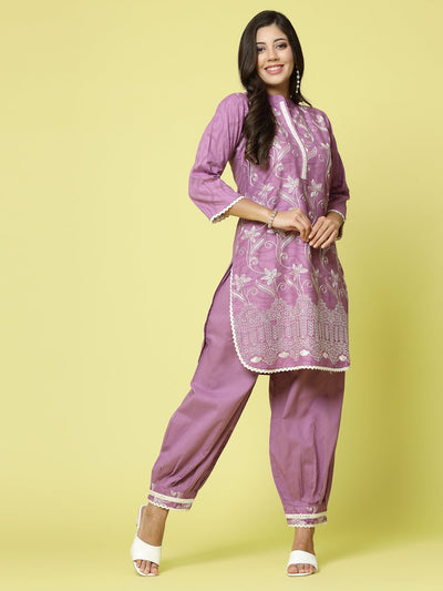 Women wearing embroidered kurta with Afghani pants co-ords set, featuring three-quarter sleeves and a mandarin collar.