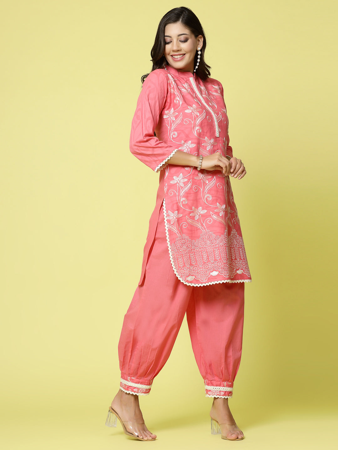 Women embroidered kurta with Afghani pants, Mandarin collar, three-quarter sleeves, elastic waistband.