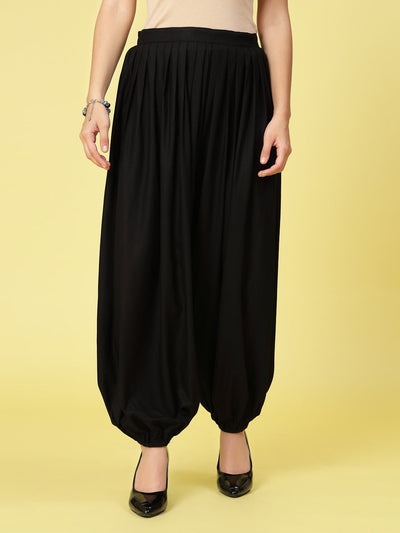 Women solid rayon loose fit salwar with pleated detail and elasticated hem.