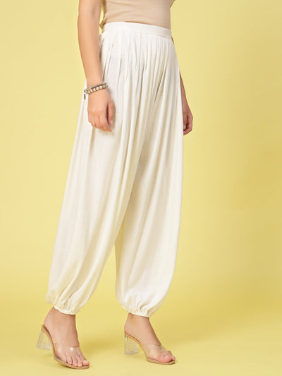 Women solid rayon loose fit salwar with pleated detail and elasticated waistband.