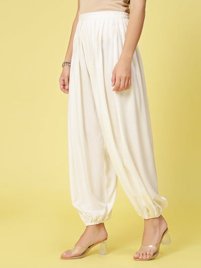 Women solid rayon loose fit salwar with pleated detail and elasticated waistband.