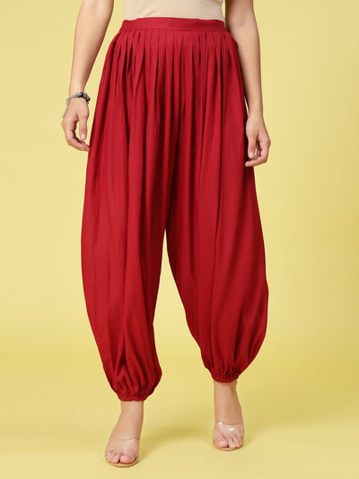 Women solid rayon loose fit salwar with pleated detail and elasticated waistband.