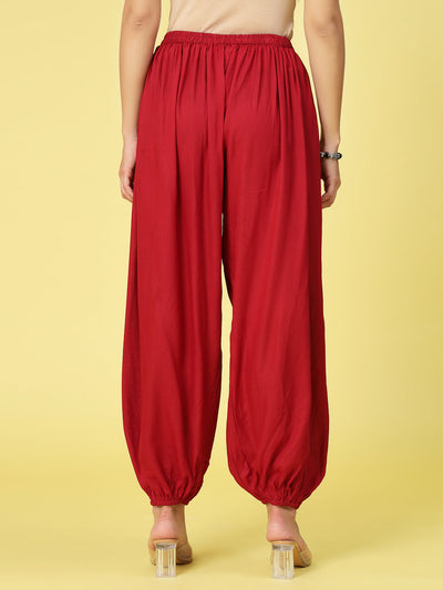 Women solid rayon loose fit salwar with elasticated waistband and hem.