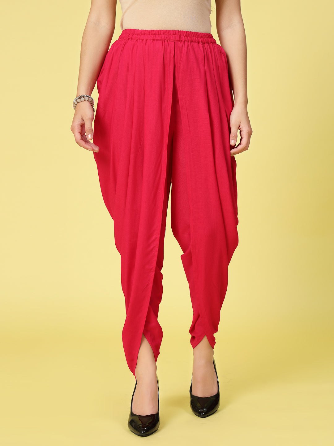 Women solid rayon dhoti salwar with pleated detail and elastic waistband.