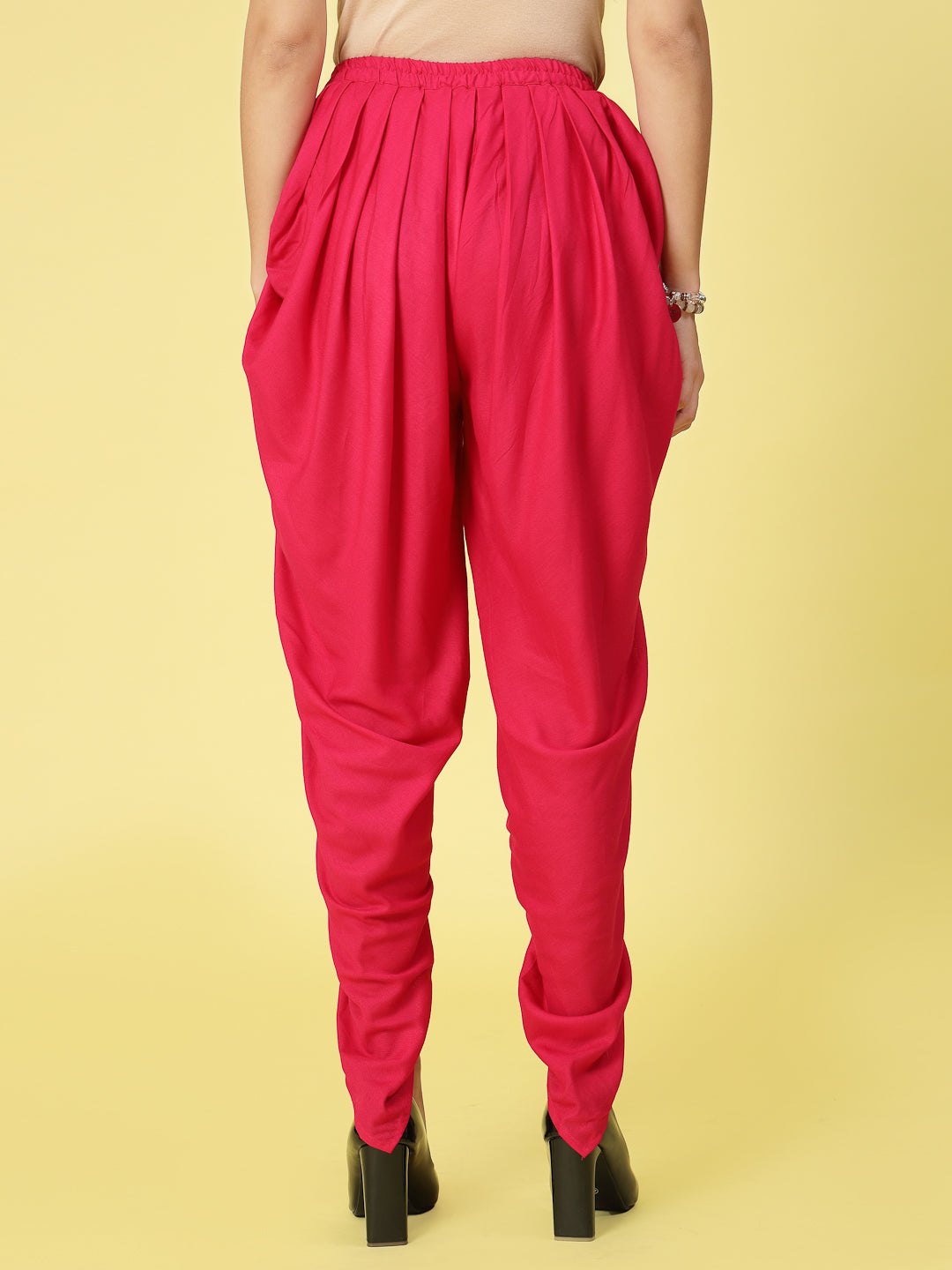 Women solid rayon dhoti salwar with pleated detail and elastic waistband.