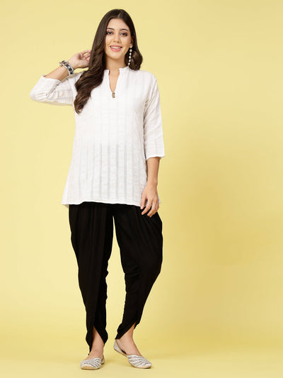 Women wearing black solid rayon dhoti salwar with elastic waistband.