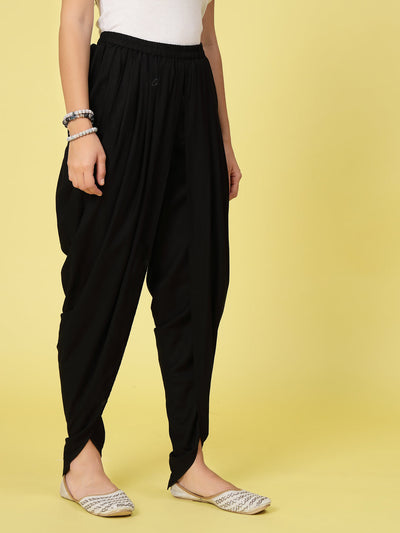 Women solid rayon dhoti salwar with pleated detail.