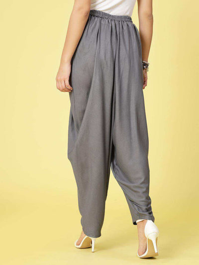 Women Solid Rayon Dhoti Salwar with elastic waistband and curved ankle hemline.