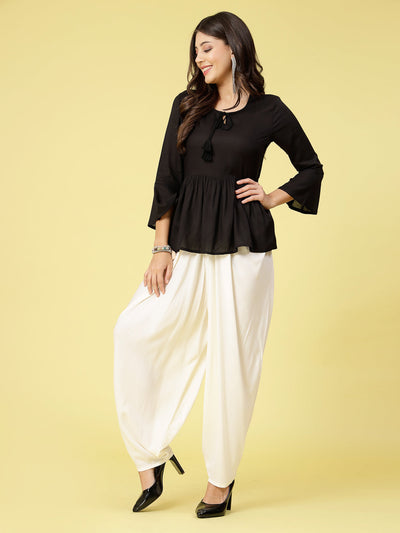 Women wearing white rayon dhoti salwar with elasticated waistband.