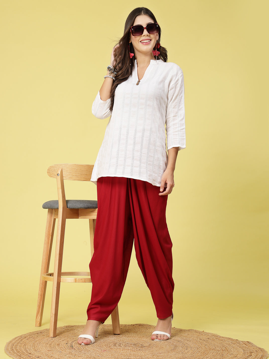 Women wearing a white top and red solid rayon dhoti salwar with elasticated waistband.
