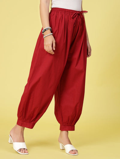 Maroon Solid Cotton Afghani Salwar with elasticated waistband and drawstring.