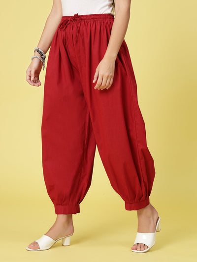 Maroon solid cotton Afghani salwar with elasticated waistband and drawstring.