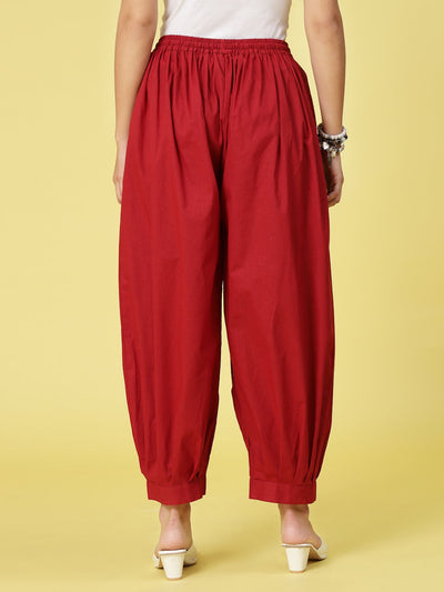 Maroon solid cotton Afghani salwar with elasticated waistband.