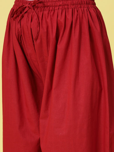 Maroon solid cotton Afghani salwar with elasticated waistband and drawstring.
