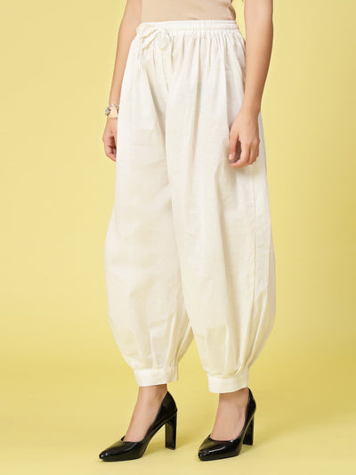 Off-White Cotton Afghani Salwar with elastic waistband and drawstring.