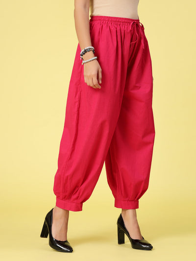 Magenta solid cotton Afghani salwar with elasticated waistband and drawstring.