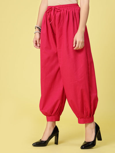 Magenta solid cotton Afghani salwar with elasticated waistband and drawstring.