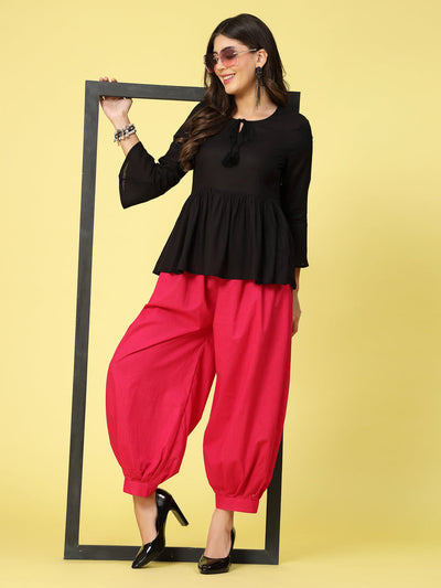Magenta solid cotton Afghani salwar with elasticated waistband.