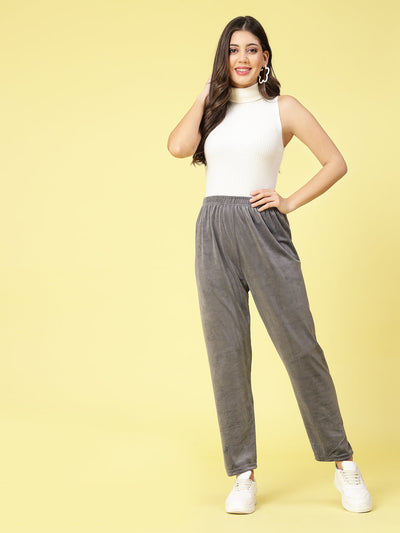 Women wearing gray velvet straight fit palazzo with elasticated waistband.