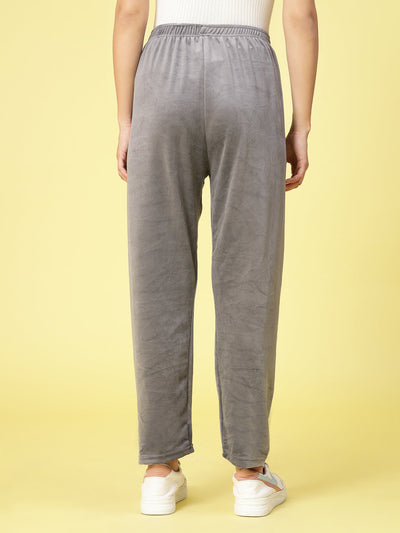 Women wearing gray velvet straight fit palazzo with elasticated waistband.