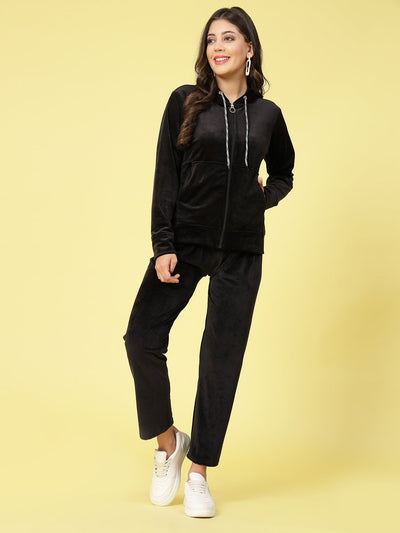 Women wearing solid hooded velvet co-ord set with long sleeves and elasticated waistband.