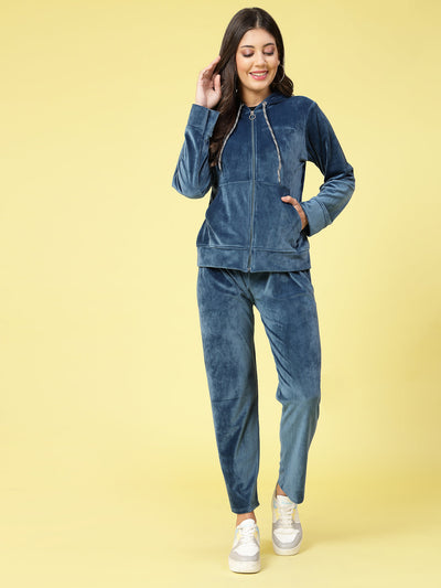 Women wearing a solid hooded velvet co-ord set with long sleeves and zip closure.