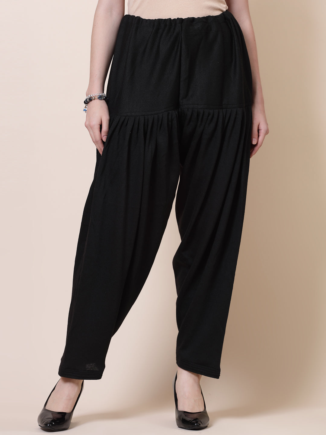 Black woollen semi Patiala salwar with drawstring closure.