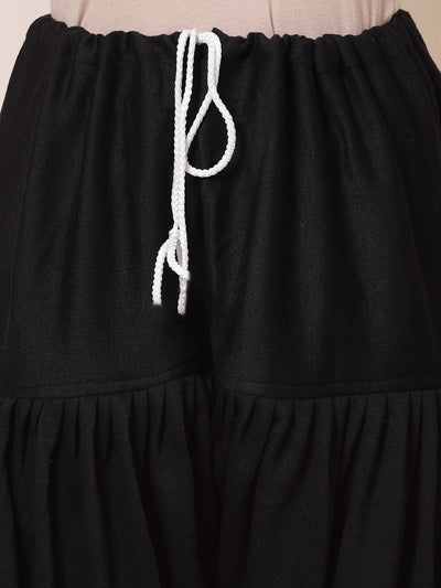 Black woollen semi Patiala salwar with drawstring closure.