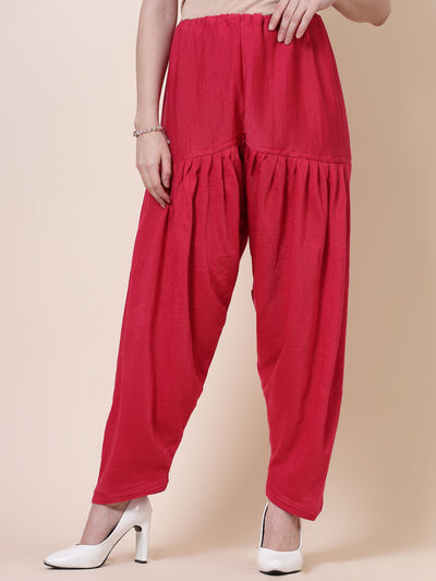 Magenta solid woollen salwar with drawstring closure.