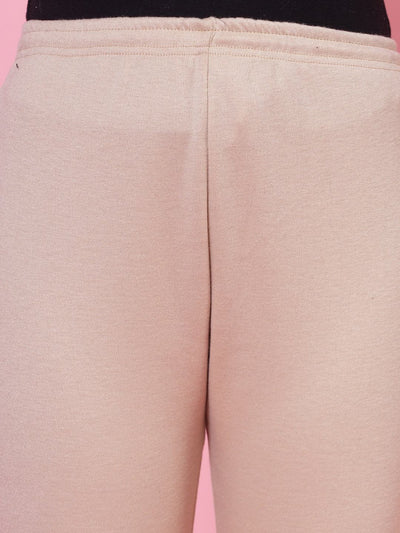 Black and light fawn woollen leggings with elasticated waistband and drawstring closure.