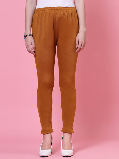 Mustard woollen leggings with elasticated waistband and drawstring closure.