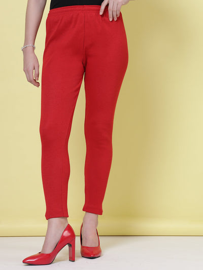 Red and light fawn solid woollen leggings with elasticated waistband and drawstring.