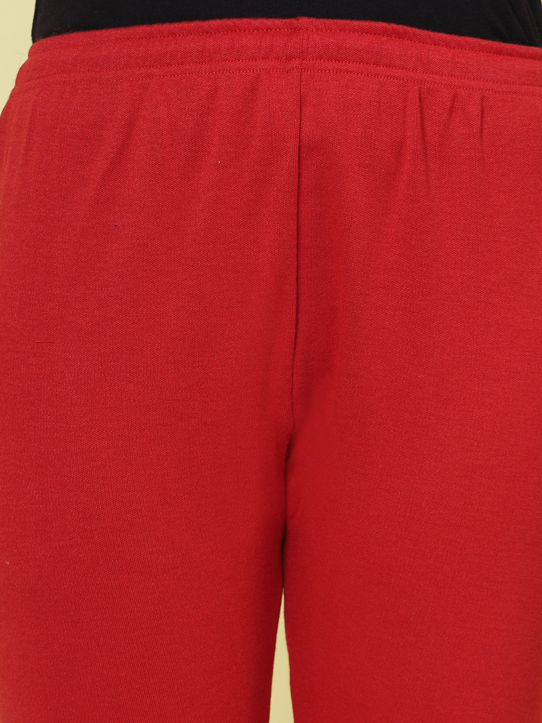 Red woollen leggings with elasticated waistband and drawstring.