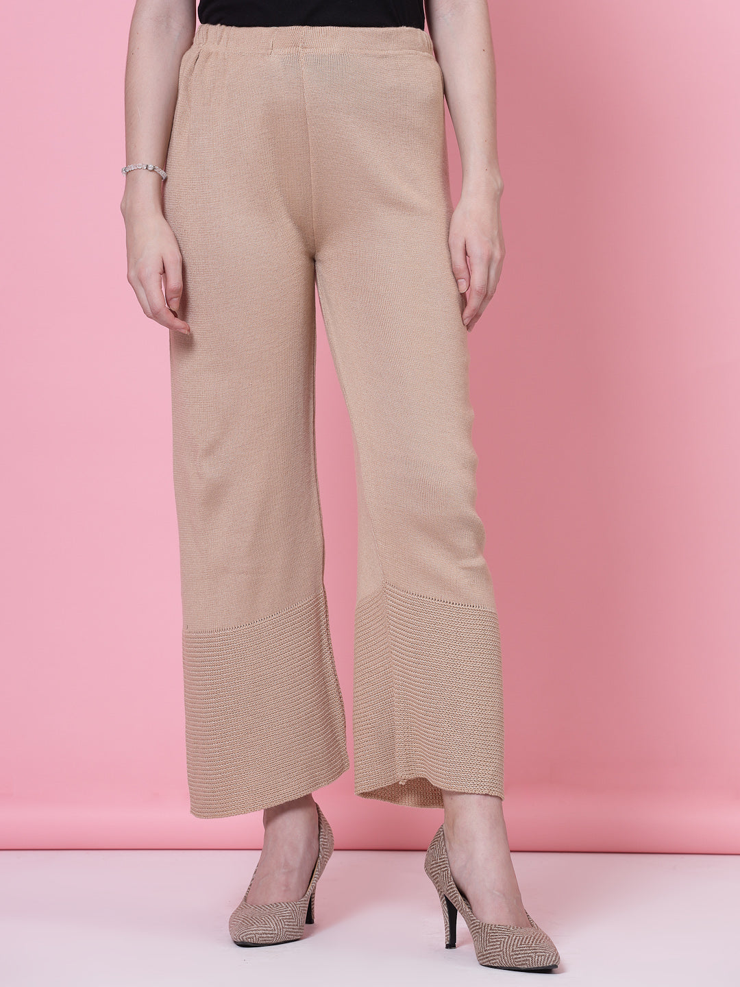 Red and beige solid woollen palazzo with elastic waistband.
