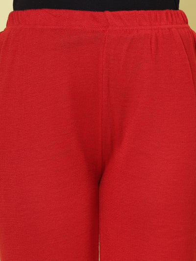 Red solid woollen palazzo with elastic waistband.