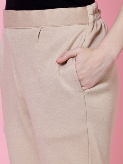 White and light fawn solid woollen trouser pack with elastic waistband and side pockets.