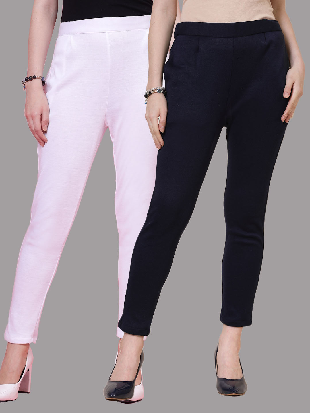 White and navy blue solid woollen trousers with elastic waistband and side pockets.