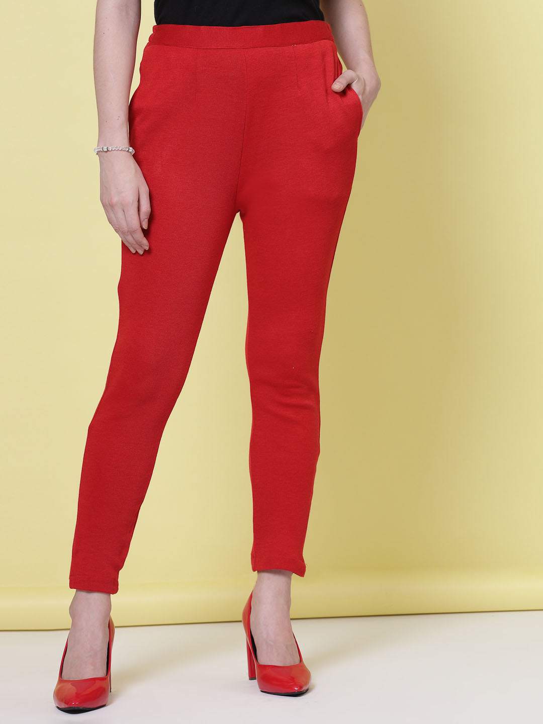 Red solid semi Patiala woollen salwar with elasticated waistband.