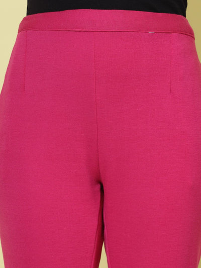 Magenta woollen trouser with elastic waistband and side pockets.