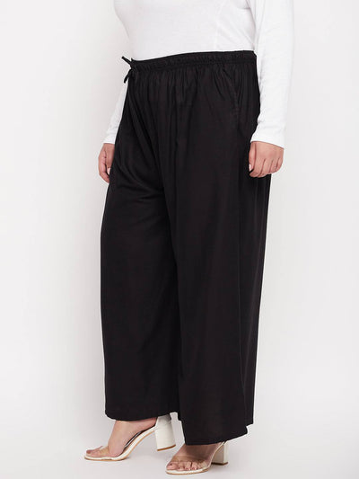 Black Solid Rayon Jumbo Sharara with elastic waistband and drawstring.