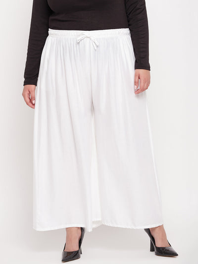 White solid rayon jumbo sharara with elastic waistband and drawstring.