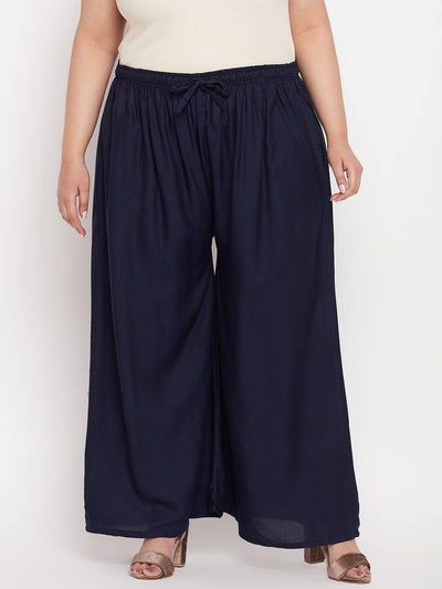 Navy blue solid rayon jumbo sharara with elasticated waistband.